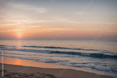 Sunset on the beach and sea waves, Generative AI © Rizka