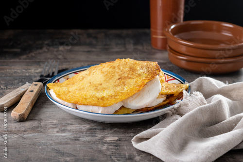 Traditional Venezuelan beef cachapa on wooden table photo