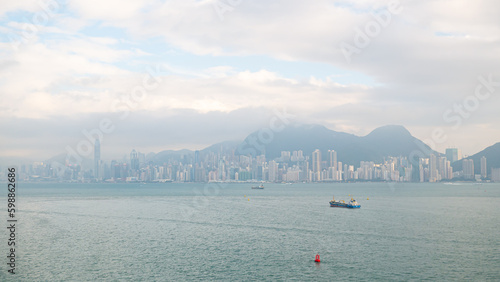 Photography View of Hong Kong Victoria Harbour cityscape with many skyscraper buildings from sea