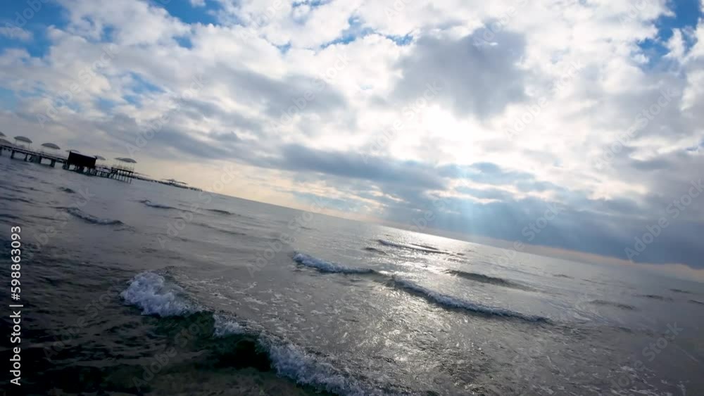 Ocean with huge cloud and pier during winter Ocean with huge cloud and pier during winter