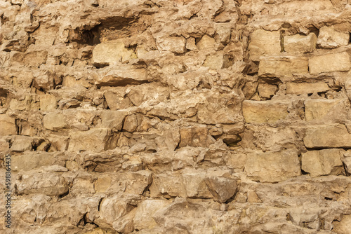 Background a wall of masonry sand-colored bricks