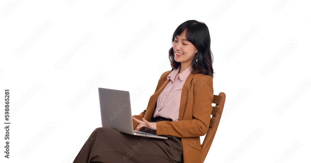 Happy young business asian woman smiling. While her using laptop sitting on wooden chair isolate on white background Happy young business asian woman smiling. While her using laptop sitting on wooden chair isolate on white background