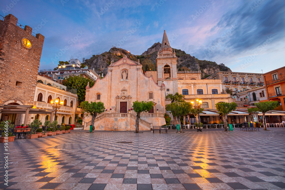 Taormina, Sicily, Italy. Cityscape image of picturesque town of Taormina, Sicily with main square Piazza IX Aprile and San Giuseppe church at sunrise.
