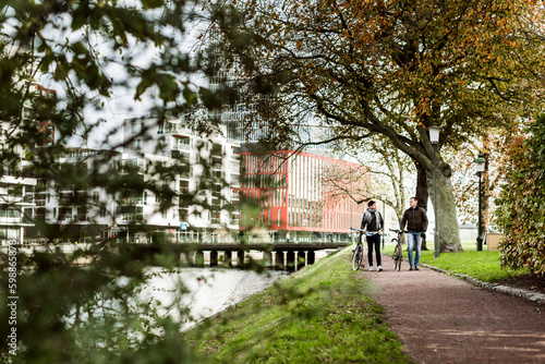 Wallpaper Mural Friends with bicycles walking in park Torontodigital.ca