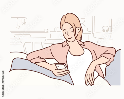Happy young woman using mobile phone while sitting a couch. Hand drawn style vector design illustrations.