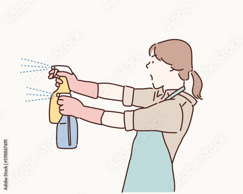 Cleaning concept. Woman hand in yellow rubber protective gloves hold cleaning agent bottle. Hand drawn style vector design illustrations.