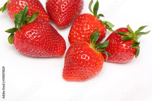 several strawberries on a white background side view studio shot isolate 1