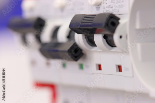 electric circuit breakers installed on a din rail in an electric switchboard for a Smart home