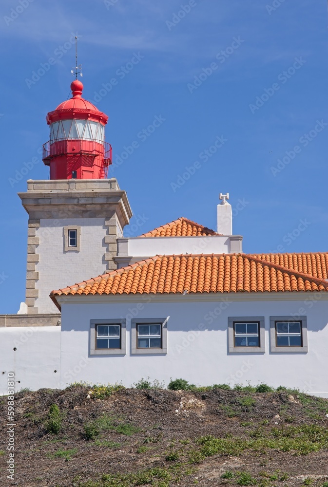 Colares, Portugal - April 2, 2023: Wonderful landscapes in Portugal. Scenic view from the Westernmost Point of Continental Europe (Cabo da Roca). Lighthouse, monument. Sunny spring day Selective focus