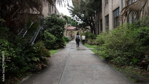 Students walking on the campus of Louisiana State University with stable video. photo