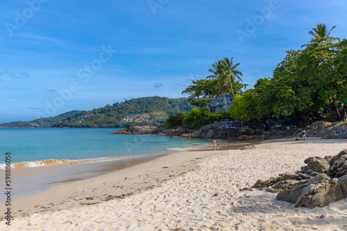 Patong Beach Phuket Thailand nice white sandy beach clear blue and turquoise waters and lovely blue skies with Palms tree