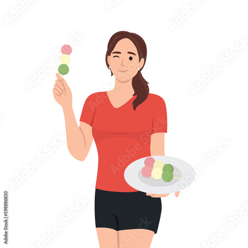 Young woman eating japanese china street food dango balls.