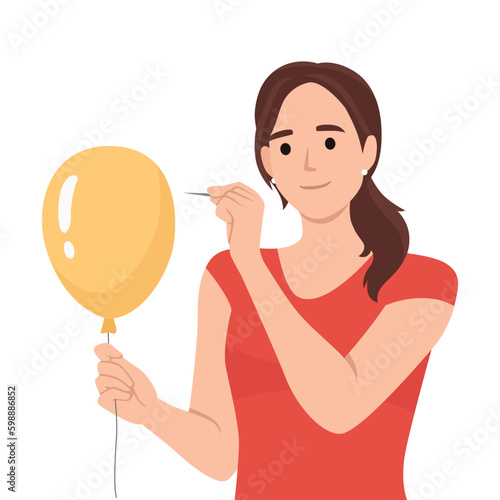 Young woman pierces balloon with needle and looks forward smiling. Teenager girl in casual clothes wanting to scare someone wants to burst red inflatable balloon.