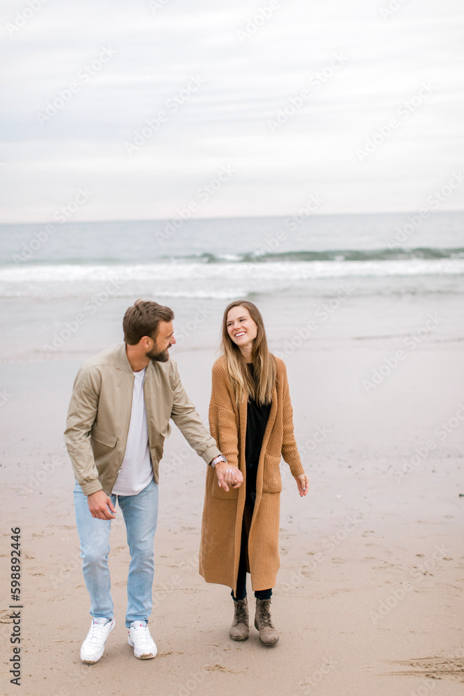 couple walking on beach couple walking on beach