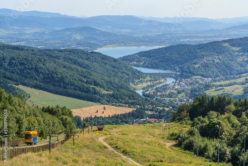 Panorama of the Soła river gorge with the villages of Międzybrodzie Żywieckie, Czernichów and Żywiec from the top of Żar in the Silesian Beskids, Poland © IwoiWo