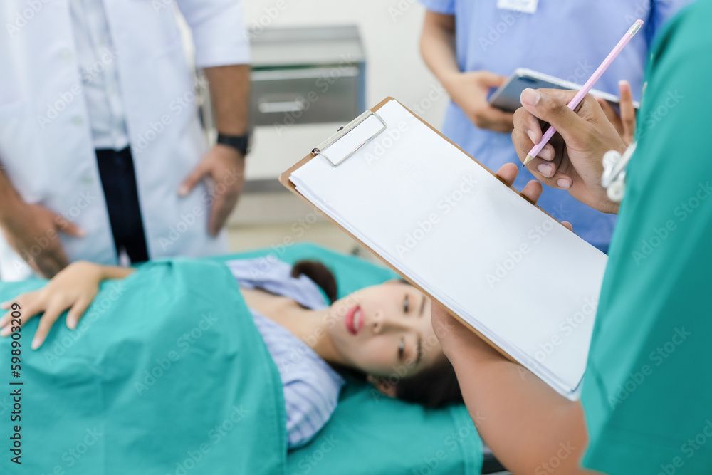 Close up hand taking notes checking up women patient symptoms on clipboard. male doctor taking notes examining patients women therapy for symptoms visit in hospital. Close up hand taking notes checking up women patient symptoms on clipboard. male doctor taking notes examining patients women therapy for symptoms visit in hospital.