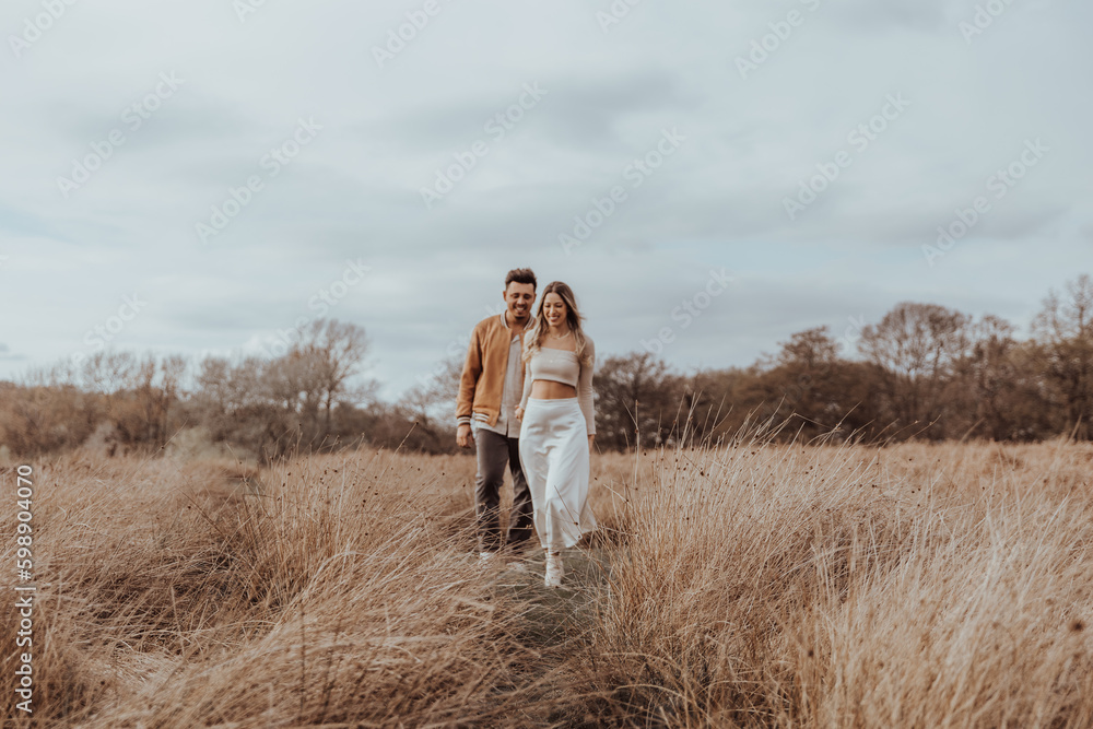 happy couple in the park on a beautiful sunny day happy couple in the park on a beautiful sunny day