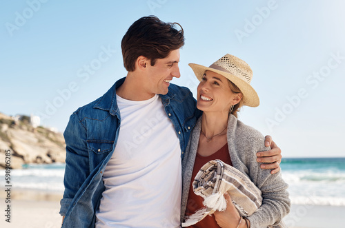 All you nee is sunshine and love. a middle aged couple spending the day at the beach. photo