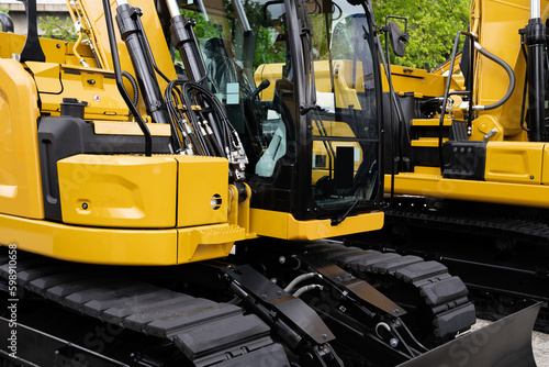 Fleet of yellow construction machines.