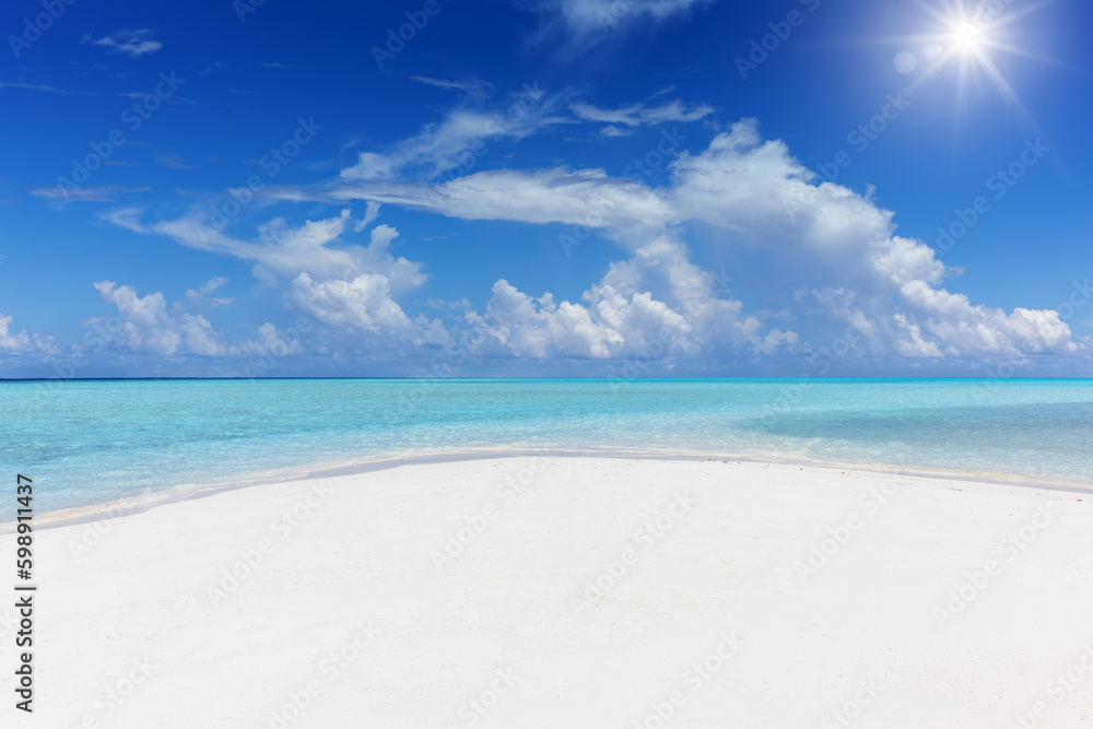 A beautiful tropical beach with fine sand and turquoise sea in the Indian Ocean as a background