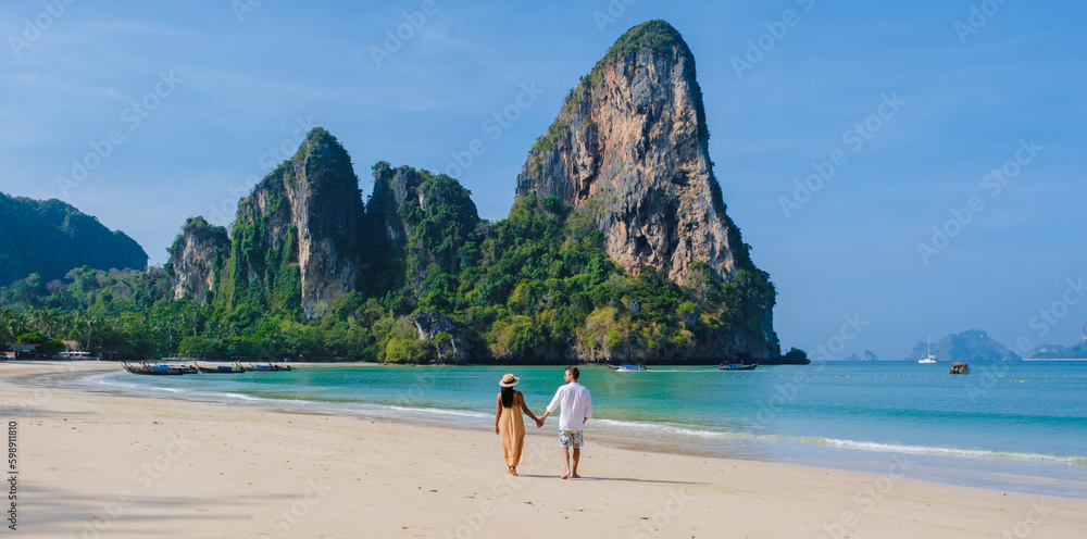 Fototapeta premium A couple of men and women at Railay Beach Krabi Thailand, the tropical beach of Railay Krabi