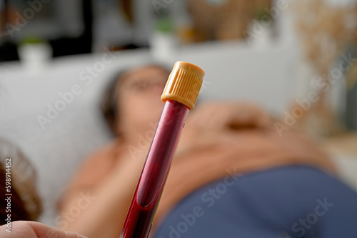 nurse taking blood sample at home photo