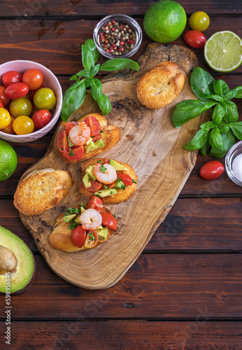 Homemade bruschetta with shrimps  avocado and cherry tomato