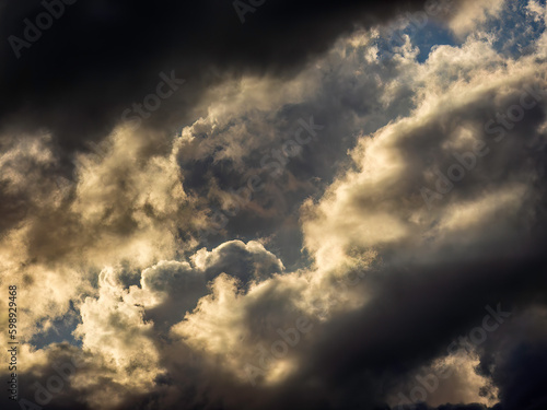 Stormy cloudscape at sunset, with a strange cloud (left center) looking vaguely like a disembodied human skull with large eye sockets, in southwest Florida