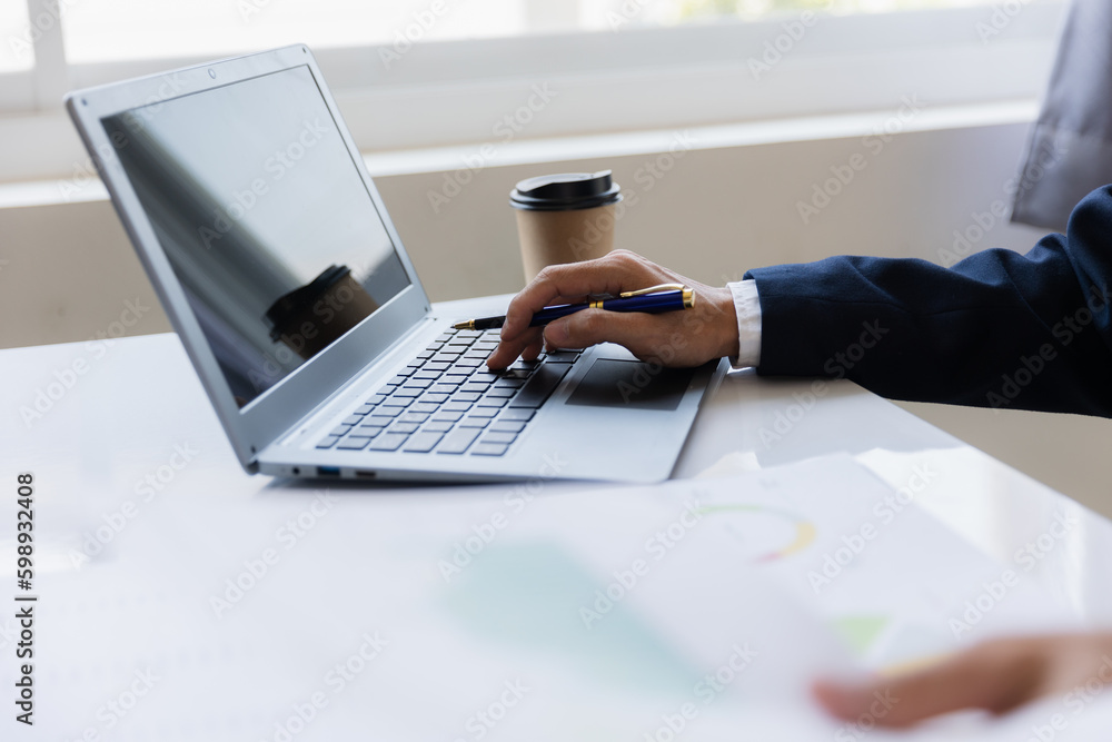 Male businessman working with calculator, business document and laptop computer notebook at room office. Male businessman working with calculator, business document and laptop computer notebook at room office.