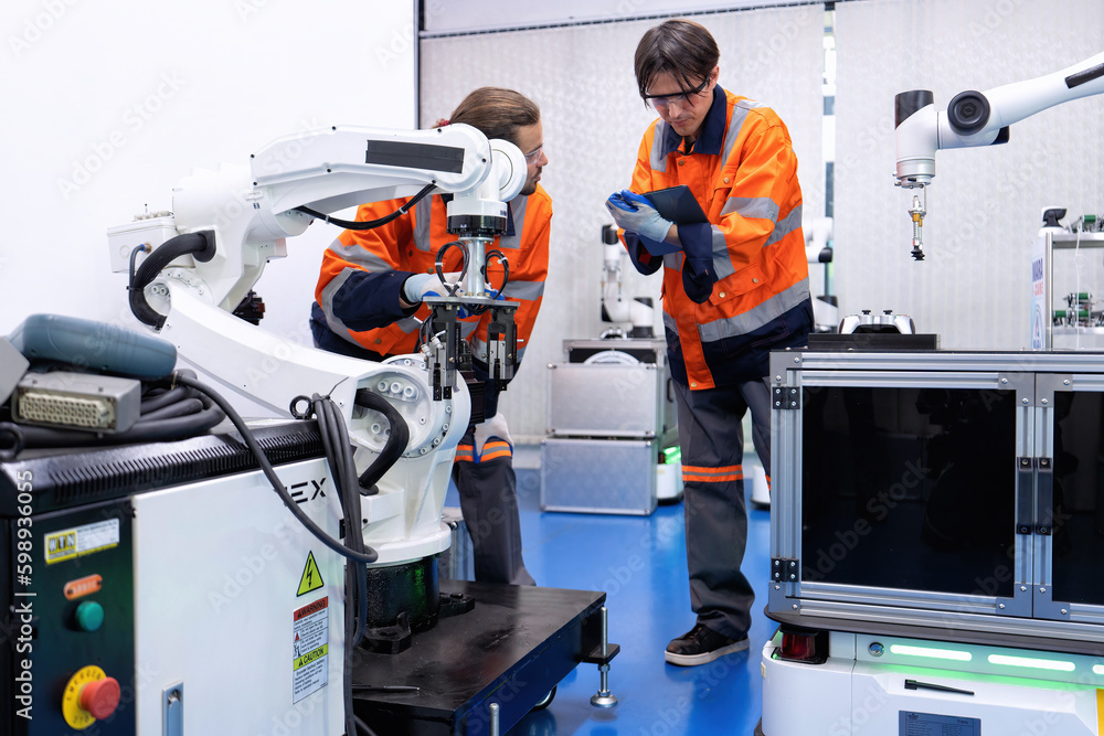 Engineer service robot welding in factory software programming operation test and commissioning Engineer service robot welding in factory software programming operation test and commissioning