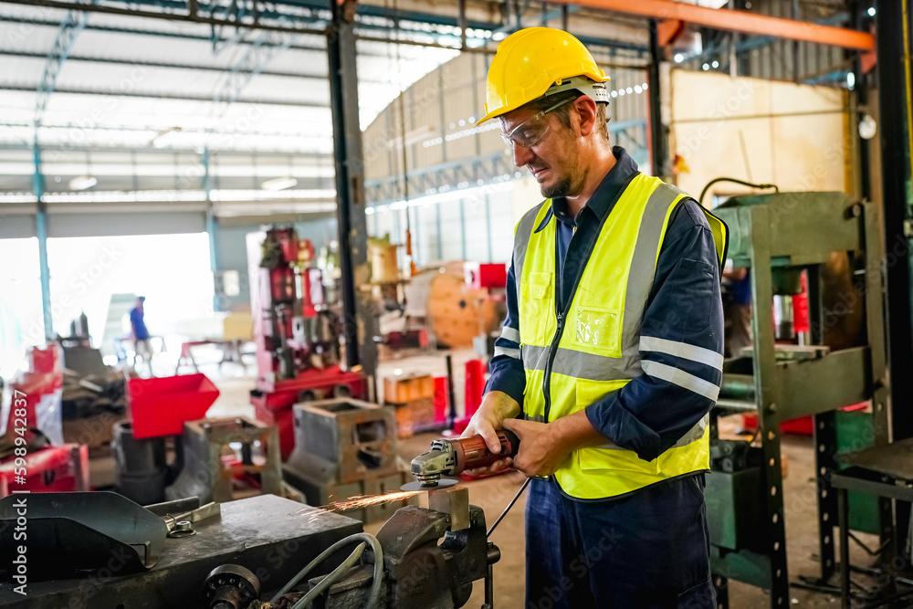 Lathe Operators Concentrated on Work. Worker in uniform and helmet works on lathe, factory. Industrial production, metalwork engineering, manufacturing.