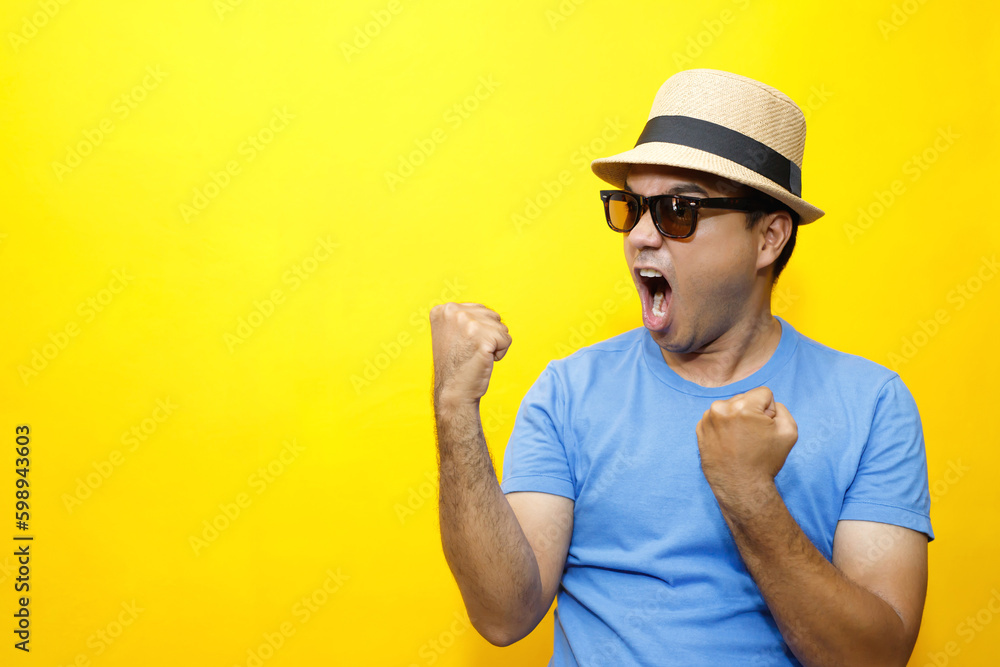 Portrait of Hipster young Asian man young happy man casual dress blue striped t-shirt and wear a hats. Gesture emotion extend the arms shy modest on studio portraits set color yellow background. Portrait of Hipster young Asian man young happy man casual dress blue striped t-shirt and wear a hats. Gesture emotion extend the arms shy modest on studio portraits set color yellow background.