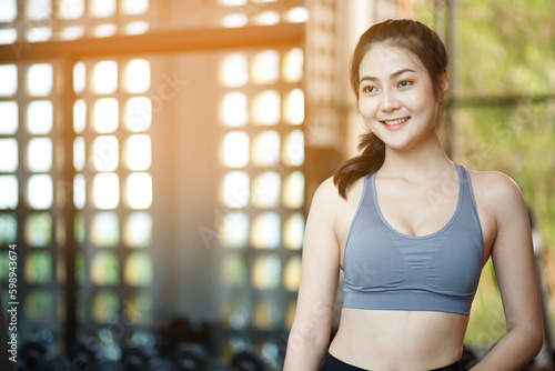 Asian woman exercising to lose weight at the gym Free Download Asian woman exercising to lose weight at the gym - GFXLoad