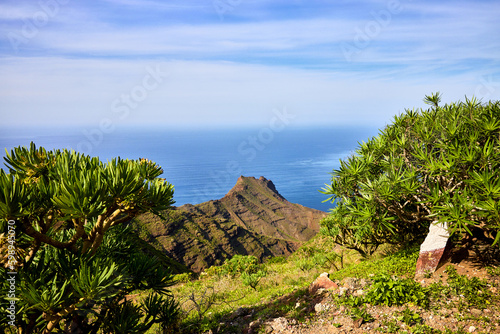 View from the scenic route Sendero Arena Blanca, Artenara, Gran Canaria. Nature and landscape with mountains of volcanic formation along the route of Sendero Arena Blanca to Mirador de Tirma. photo