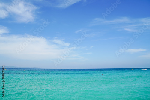 Fototapeta Naklejka Na Ścianę i Meble -  Bright blue sky, white cloud and clear sea water. Seascape outdoors vacation. Summer concept. Nature background.