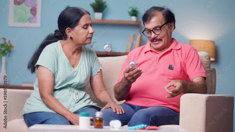 senior man with wife got happy after seeing low glucose level during daily routine sugar check up at home - concept of diabetes, health recovery and family bonding senior man with wife got happy after seeing low glucose level during daily routine sugar check up at home - concept of diabetes, health recovery and family bonding