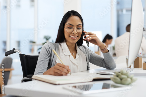 Sure, Ill call you back in a bit. an attractive young businesswoman making a phonecall while working at her desk in the office.