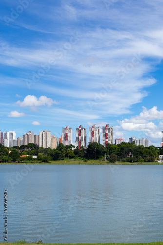 Cityscape with a lake and blue sky