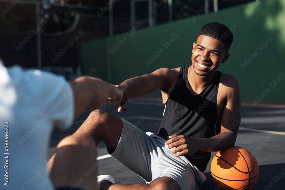Dude, you skills are mad. a sporty young man giving his teammate a fist bump on a basketball court. Dude, you skills are mad. a sporty young man giving his teammate a fist bump on a basketball court.