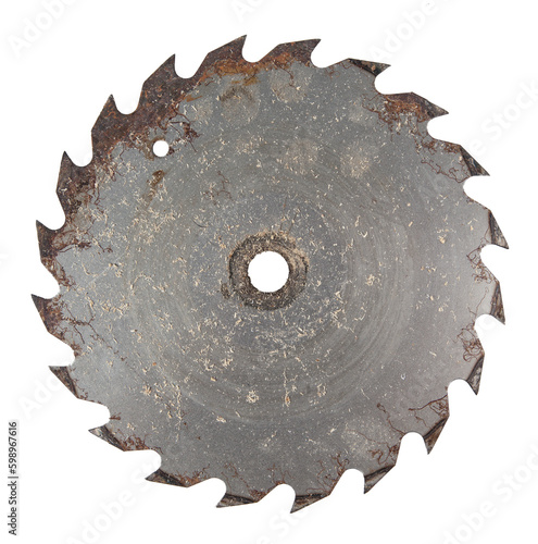 An old rusty saw blade covered in sawdust.