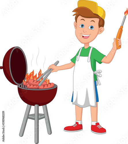 happy boy grilling sausages