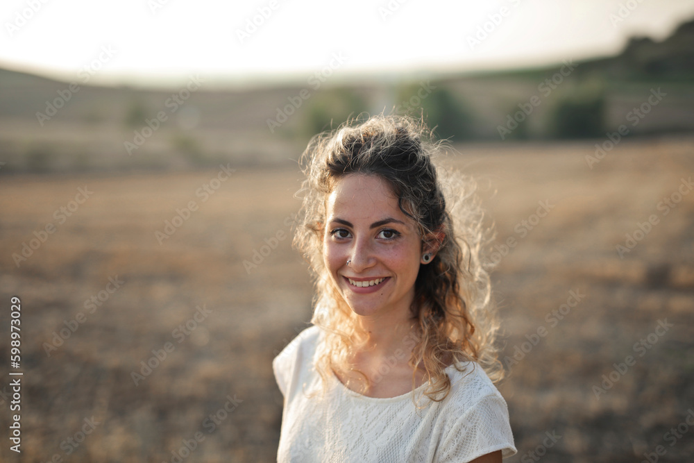 portrait of a young woman in countryside portrait of a young woman in countryside