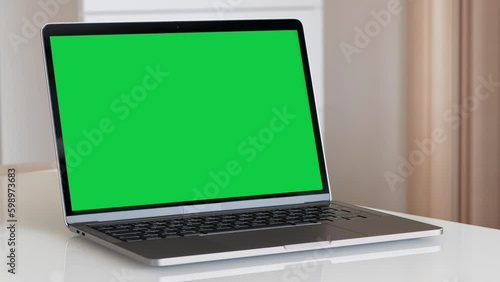 Wallpaper Mural Zooming on a Green Screen Laptop on a White Table Torontodigital.ca