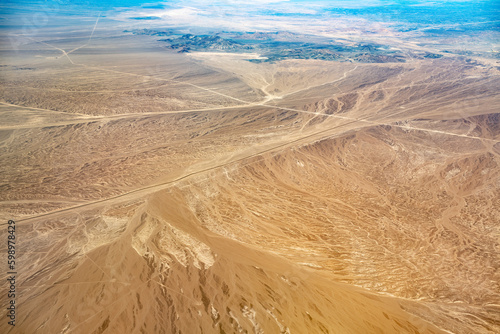 Fototapeta Naklejka Na Ścianę i Meble -  Aerial view of a road in the highlands of the Atacama Desert, Chile