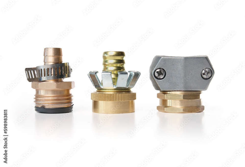 Variety of female and male hose end repair or garden hose mender. Assortment of hose connectors to repair broken, corroded or damaged garden hose. Selective focus. White background. Variety of female and male hose end repair or garden hose mender. Assortment of hose connectors to repair broken, corroded or damaged garden hose. Selective focus. White background.