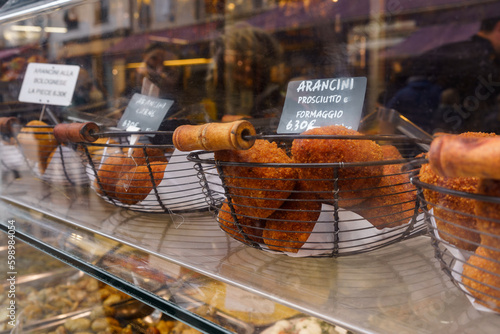 Arancini, the Italian deep fried rice balls filled with prosciutto (dried ham) and formaggio (cheese) photo