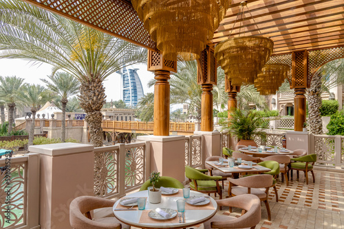 Photography A restaurant with a view of the Burj al Arab in Dubai.