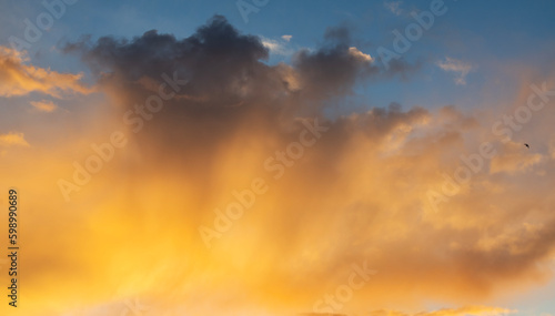 Beautiful bright summer sunset sky with clouds. Sunset sky clouds background.