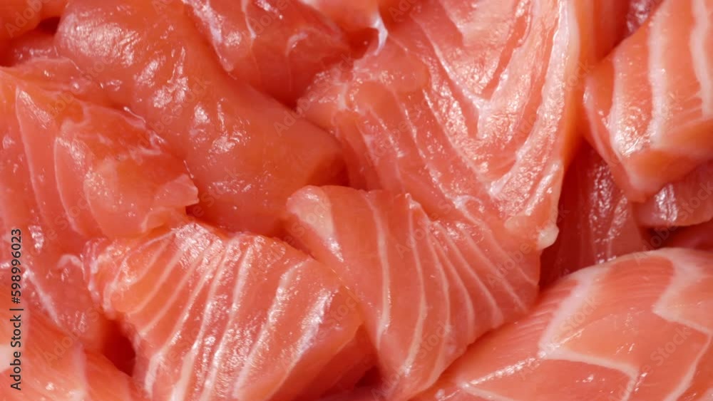 red fish slices, rotation in circle. salmon slices Turning. selective focus red fish slices, rotation in circle. salmon slices Turning. selective focus