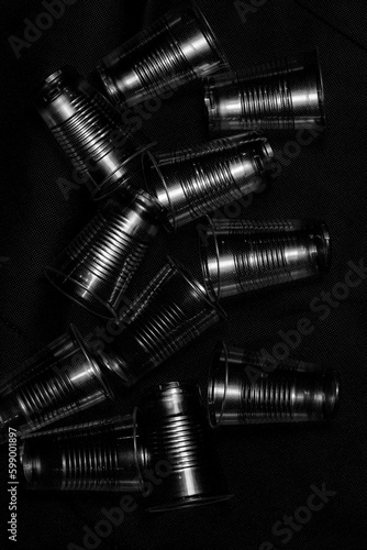 disposable plastic cup  with side light , close up in black background.